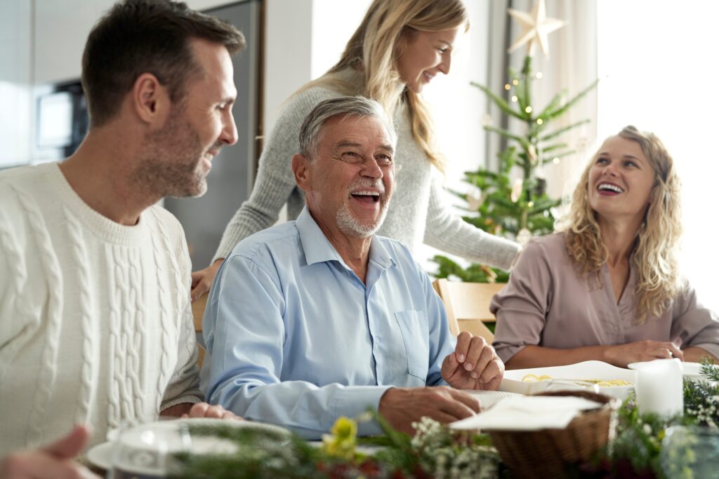 Cheerful,Caucasian,Family,Spending,Time,Over,Table,At,Christmas,Dinner